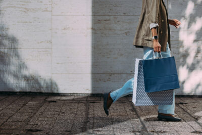 woman walking holding her shopping bags