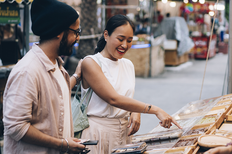 Couple Buying Chocolate On The Street Market