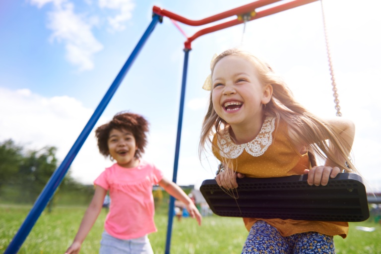 Children playing swings