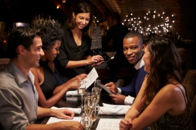 Waitress Takes Order In Restaurant