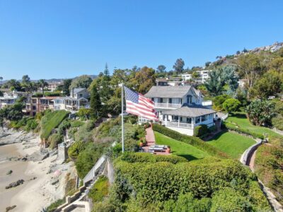 Aerial view of villa on the cliff with American Flag in Laguna Beach, California