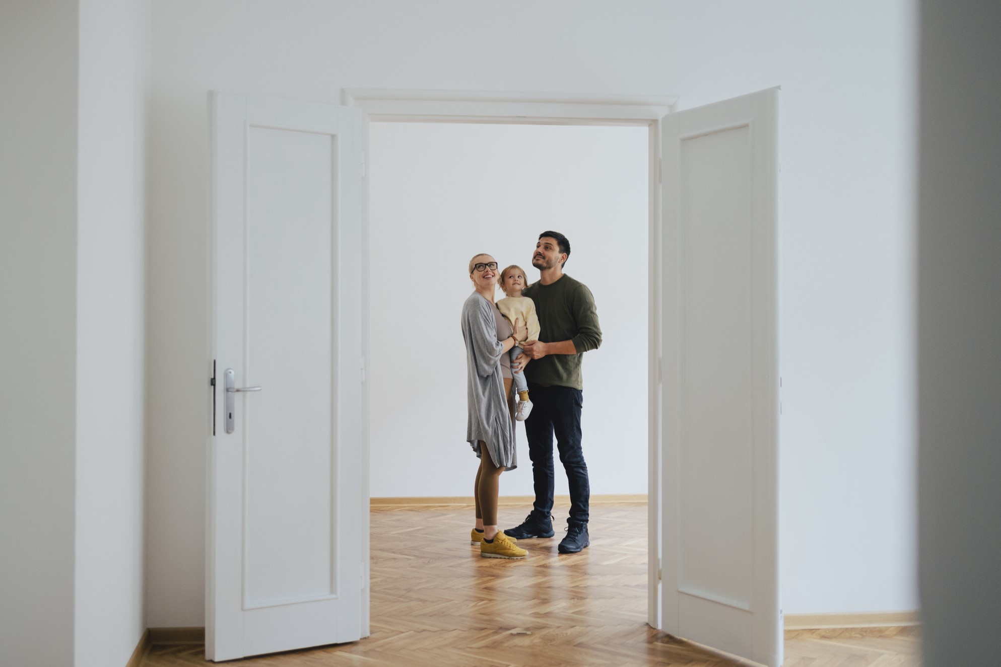 family of three in their new laguna beach home
