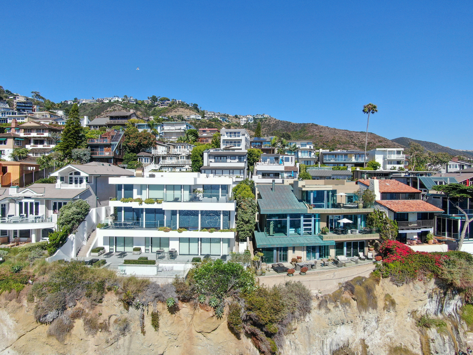 Aerial view of Laguna Beach coastline town with wealthy villas on the cliff, Southern California Coastline, USA